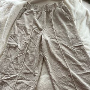 Urban Outfitters corduroy, stretchy, wide leg pants in a cream color